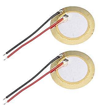 Picture showing two piezo buzzers, with red and black trailing wires.